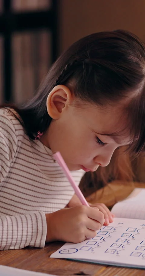 Homework, writing and math with Japanese child in home for education, knowledge Stock Footage 340970970
