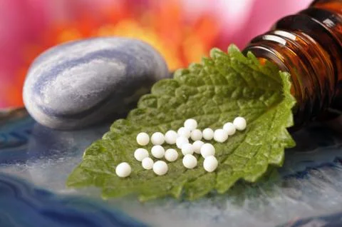 Homöopathie mit Globuli Stock Photos