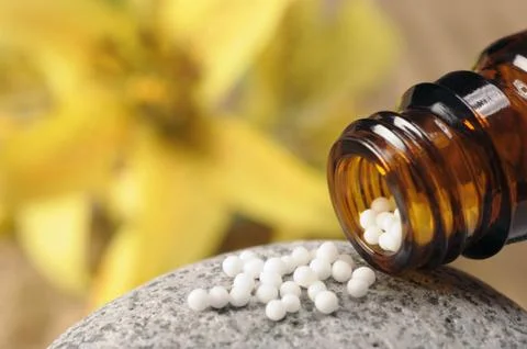 Homöopathie mit Globuli Stock Photos