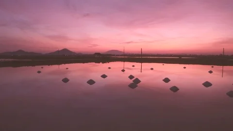 Hon Khoi salt fields ready for harvest at sunrise, Vietnam Stock Footage 99066946