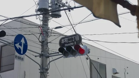Honcho 2 intersection traffic light and tangled power lines in Fujiyoshida Japan Stock Footage 335198489