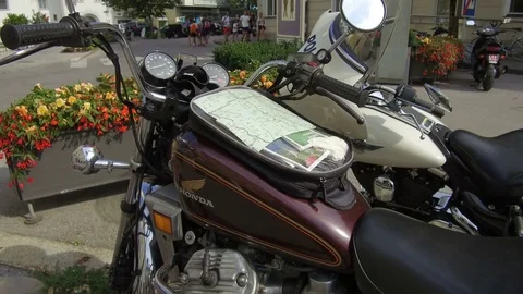 Honda motorcycle with map on tank, Lienz Austria Stock Footage 79653741