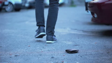 Honest man returning lost wallet to owner on street, human support and help Stock Footage 94681552