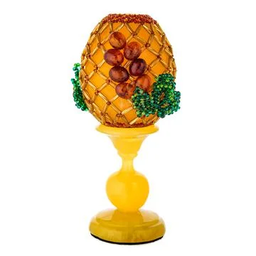 Honey Amber Easter Egg on a stand Foto stock