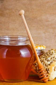 Honey and bread Stock Photos
