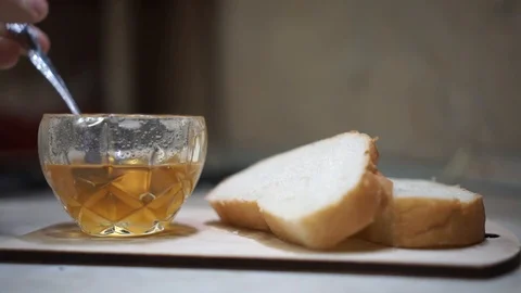 Honey and pieces of bread Stock Footage 103221709