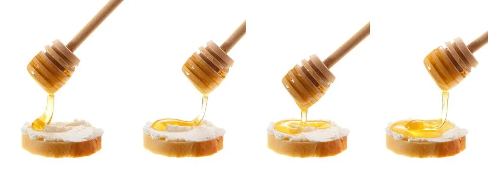 Honey is applied to the surface of bread with mascarpone. Isolated on a white Stock Photos