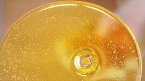 Honey background. A stream of honey flows into a glass jar, close-up Stock Footage 88367202