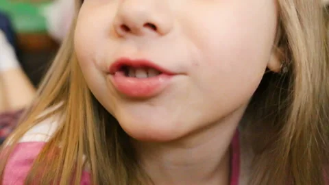 Honey, beautiful baby's looking at the camera. The girl has complete heterochrom Stock Footage 88282375