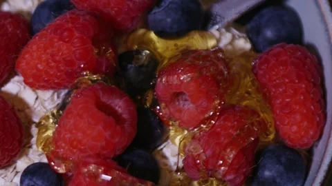 Honey on berries Stock Footage 336724549