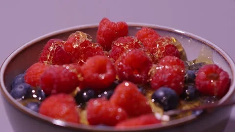 Honey on berries Stock Footage 336725829