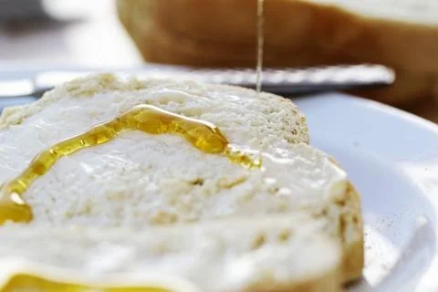 Honey on bread Stock Photos