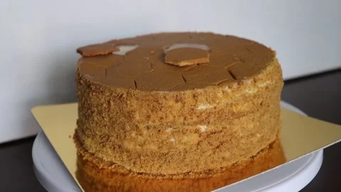 Honey cake on golden plate. Stock Footage