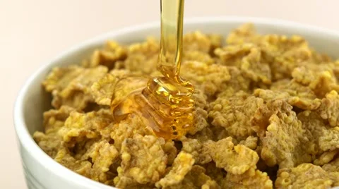 Honey on cereal, Slow Motion Stock Footage 12501037