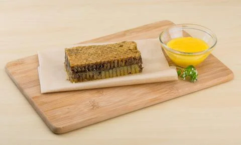 Honey with comb Stock Photos