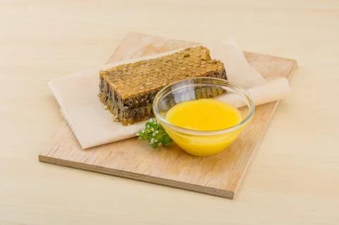 Honey with comb Stock Photos