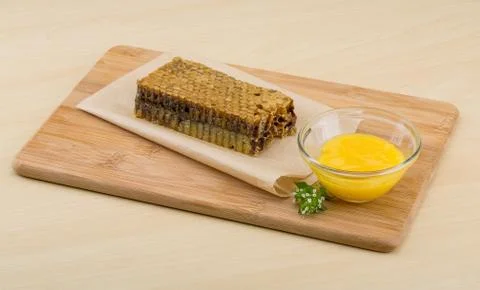 Honey with comb Stock Photos