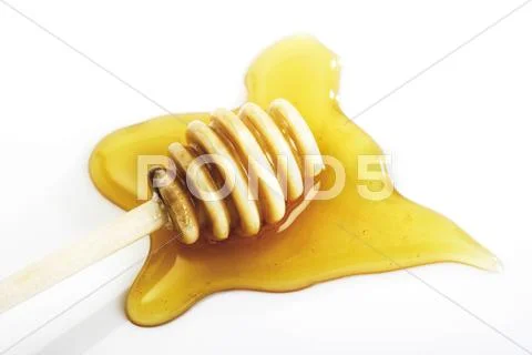 Honey dripper, honey Stock Photos