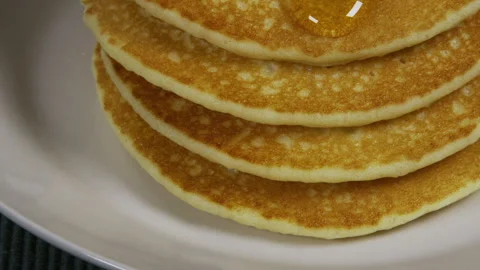 Honey Dripping Down A Pancake Stack 스톡 동영상 243413982