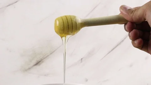 Honey dripping marble background Stock Footage 96381393