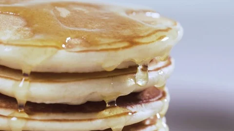 Honey dripping on a pancake Stock Footage 72670632