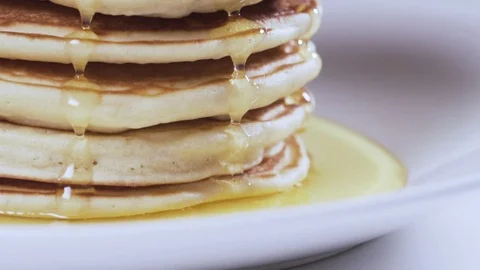 Honey dripping on a pancake Stock Footage 72670683