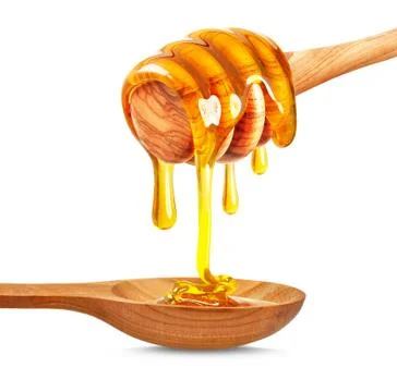 Honey dripping Stock Photos