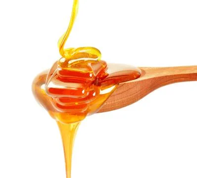 Honey  dripping Stock Photos