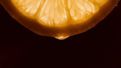 Honey dripping from slice lemon - close-up Stock Footage 127853468