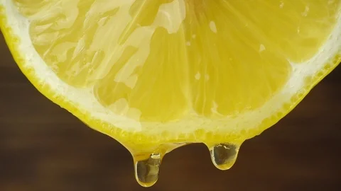 Honey dripping from slice lemon Stock Footage 89189051