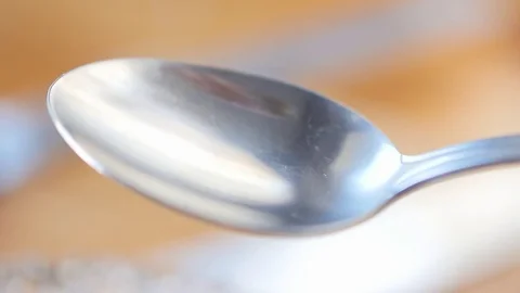 Honey Dripping Into A Spoon Stock Footage 72990327