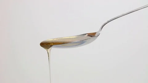 Honey dripping off spoon 動画素材 123645677