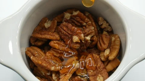 Honey drips on walnuts Stock Footage 126977995