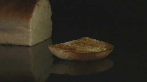 Honey drizzling onto toasted bread Stock-Footage 107780