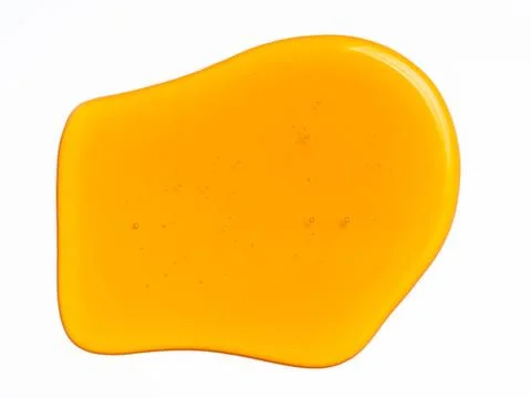 Honey drop abstract pattern or background, isolated on white Honey drop ba... Foto stock