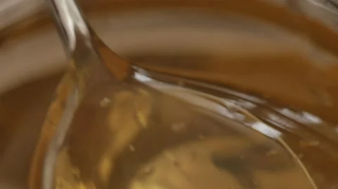 Honey drop falling in the jar Stock Footage 50616202