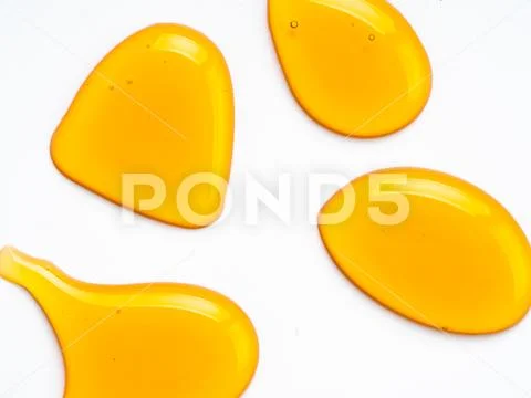 Honey drops abstract pattern, isolated on white Stock-Fotos