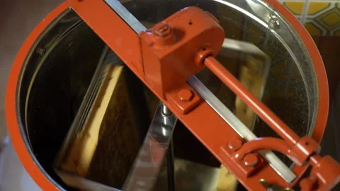 Honey Extractor Machine Spins Honeycomb around. Removing Honey. slow motion Stock Footage 135358433