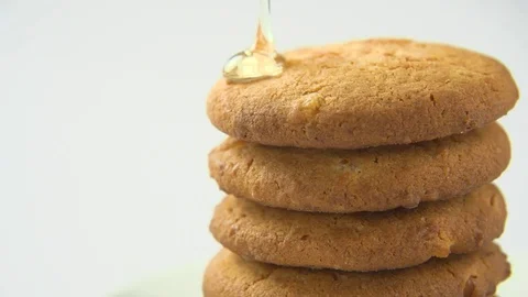 Honey flows on cookies Stock Footage 83043113