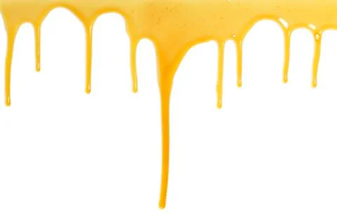 Honey flows over a white background Stock Photos