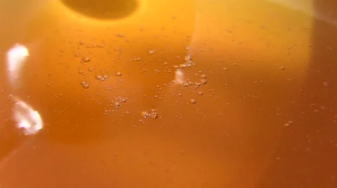 Honey flows from a spoon Stock Footage 50125909