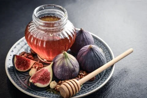 Honey with fresh figs Stock Photos