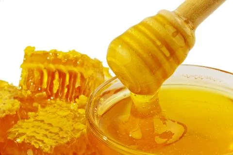 Honey in front of white background Stock Photos