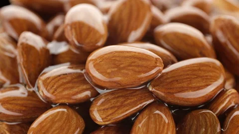 Honey glazed almonds close up Video stock 243173371