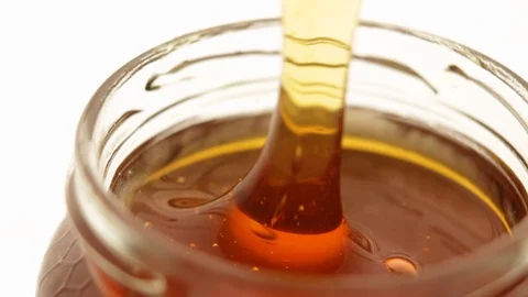 Honey jar with spoon Stock-Footage 101898743