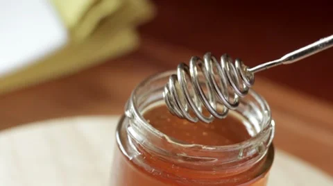 Honey in jar on table Video stock 7734042