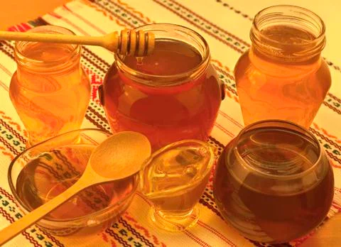 Honey jars on table Stock Photos