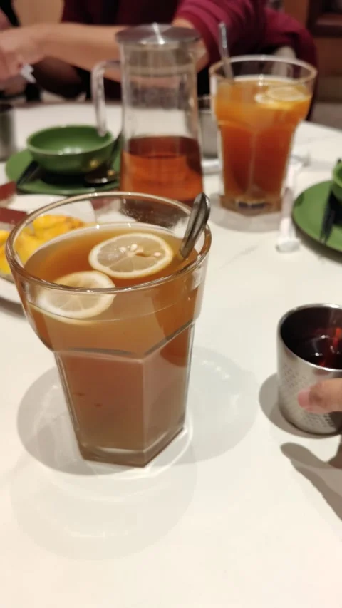 Honey Lemon Tea served on the table. Vertical Stock Footage 321668893