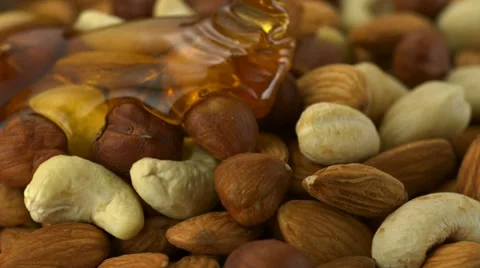 Honey on nuts, Slow Motion Stock Footage 12506198