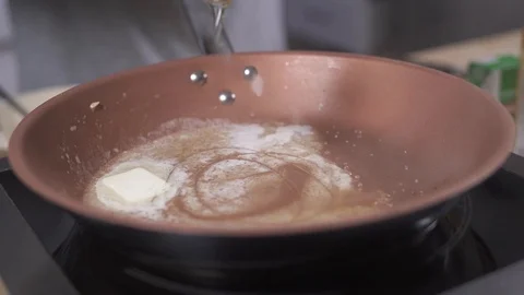 Honey into the pan Stock Footage 127360174